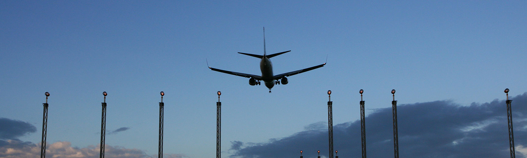 Plane flies over skyscrappers