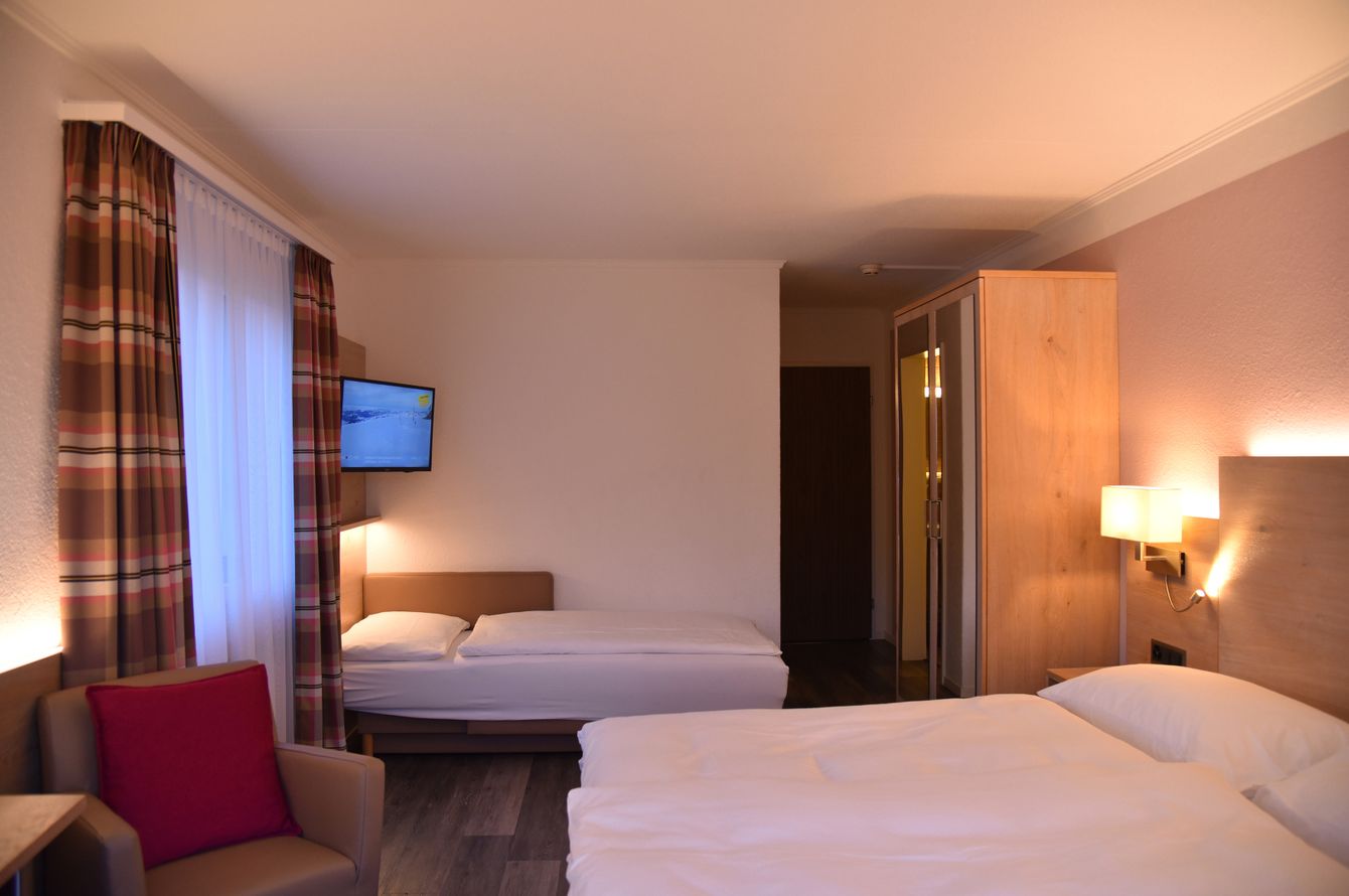 Chambre à trois lits