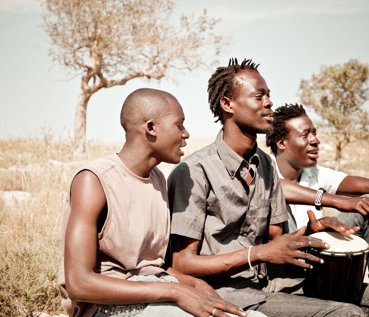 Drei Männer beim Musizieren – afrikanische Lebensfreude in reinster Form